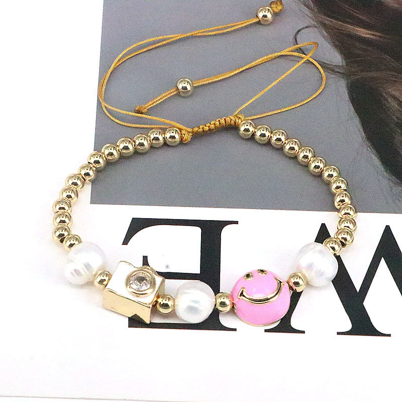 Gotas de color al por mayor Smile de aceite Circón Pearl de agua dulce Pearl Ronda Bead Pulsera de cobre